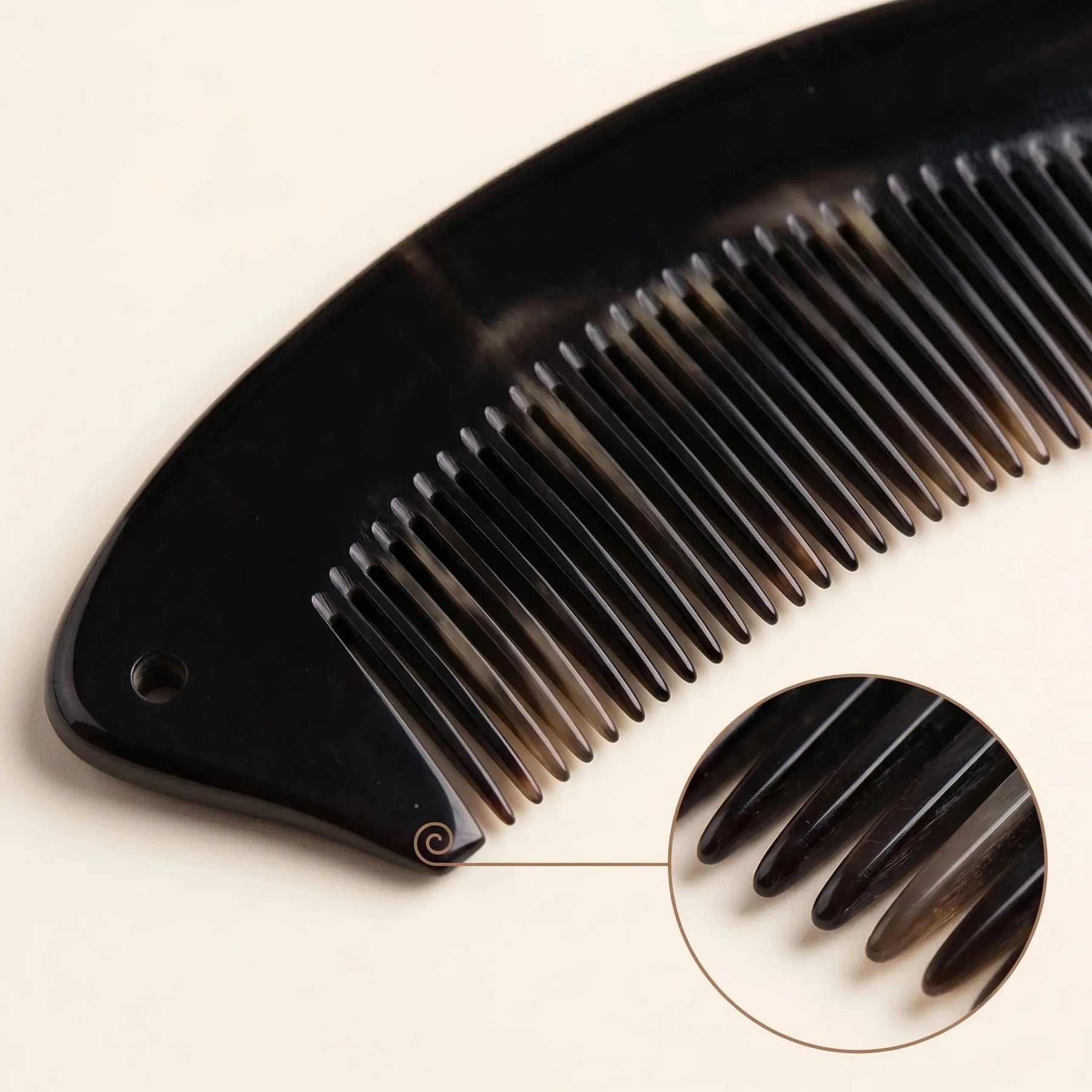 COZUY black ox horn crescent pocket comb close-up showing deep black horn grain and polished fine teeth. detail image 2