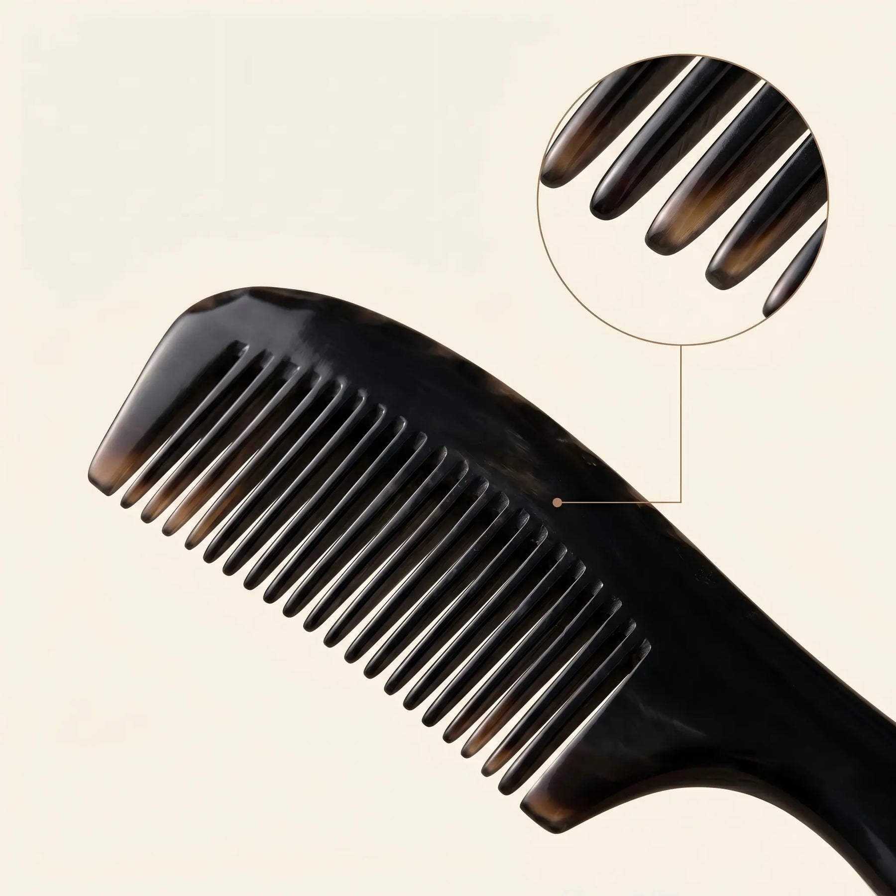 COZUY black ox horn rounded-handle comb close-up showing polished black horn and smooth fine teeth. detail image 2