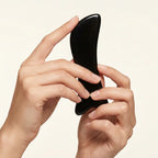 Close-up of a hand-polished Cozuy buffalo horn hair accessory highlighting its smooth edges for a gentle massage