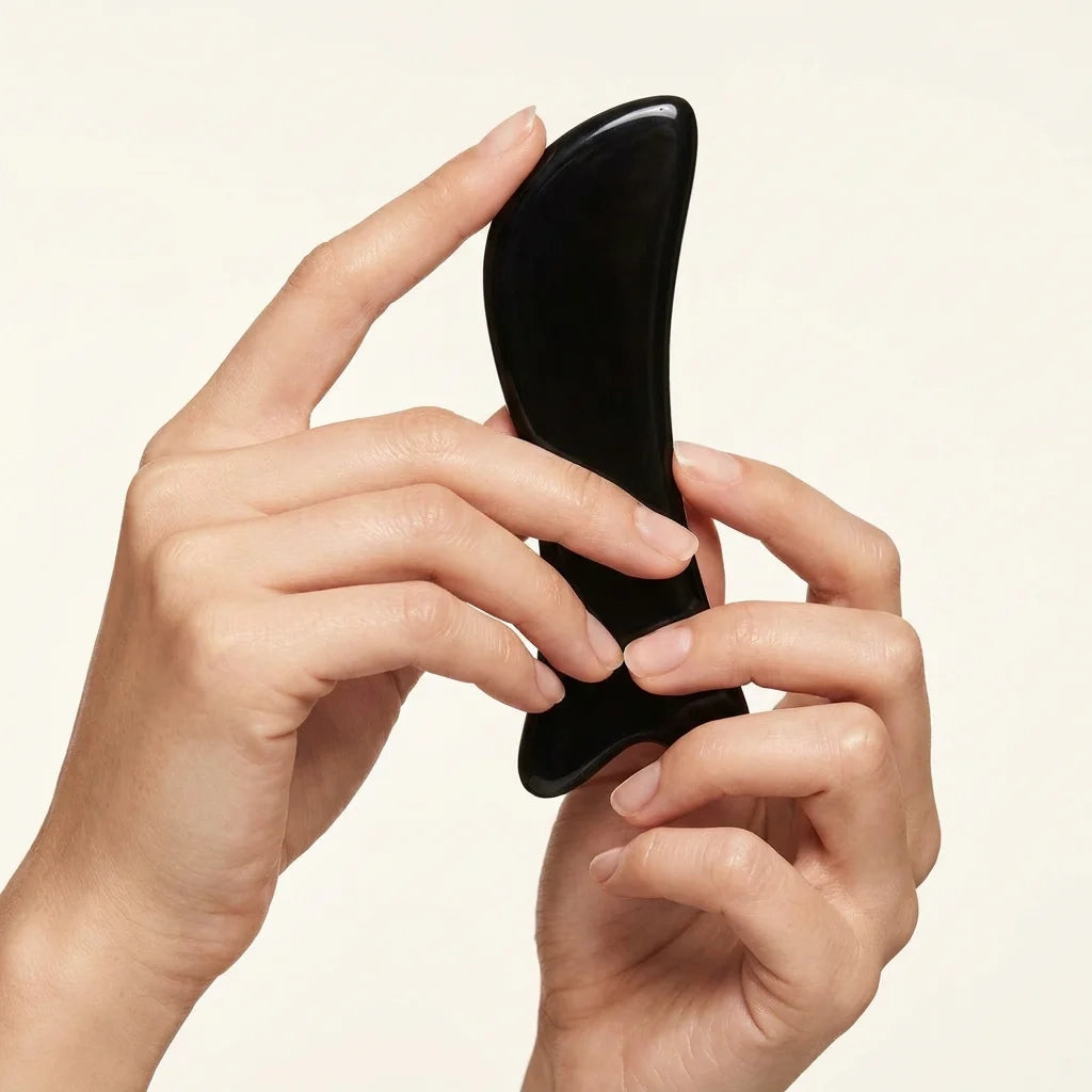 Close-up of a hand-polished Cozuy buffalo horn hair accessory highlighting its smooth edges for a gentle massage