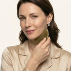 An elegant woman using a Cozuy natural beauty tool during her daily ritual for a gentle massage and mindful self care
