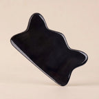 A Cozuy natural beauty tool standing on a beige background, perfect for a mindful scalp care routine