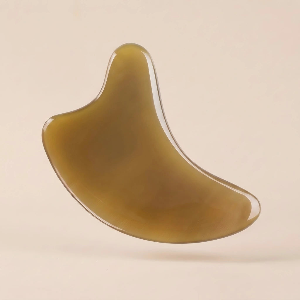 A translucent Cozuy natural beauty tool floating on a beige background, crafted for a mindful self care routine.