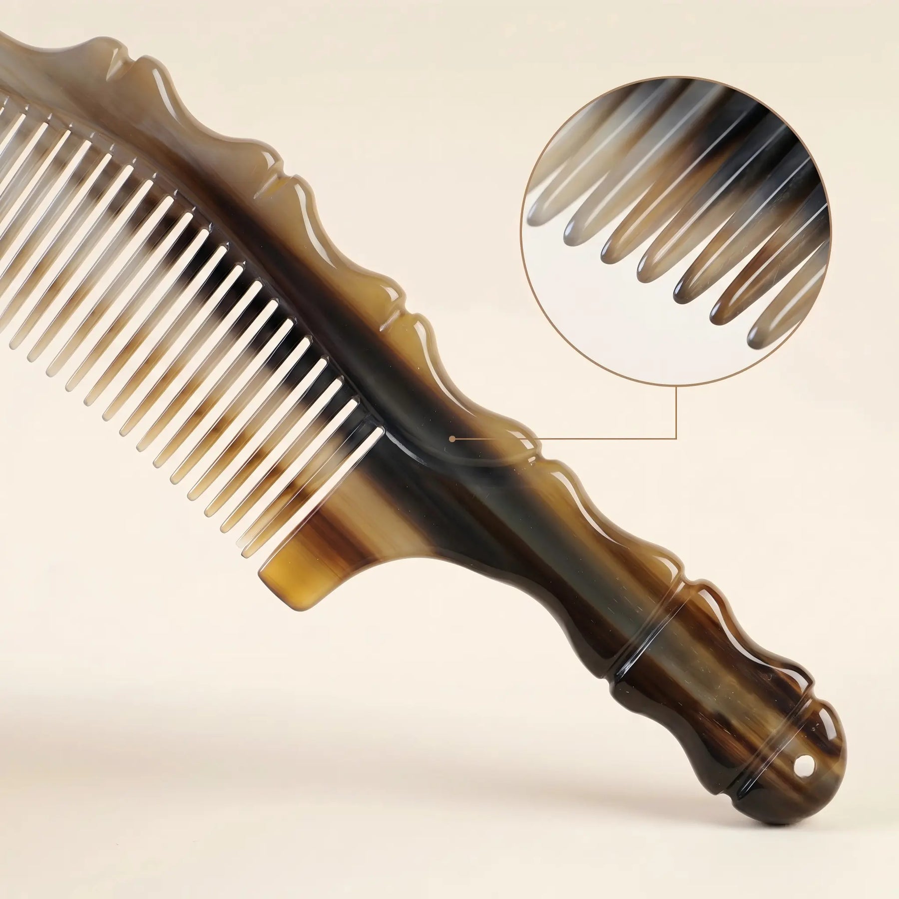 COZUY natural yak horn wave-spine comb close-up showing contrasting horn grain and polished fine teeth. detail image 2