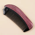 Curved natural horn pocket comb resting on a beige background, versatile scalp gua sha tool.