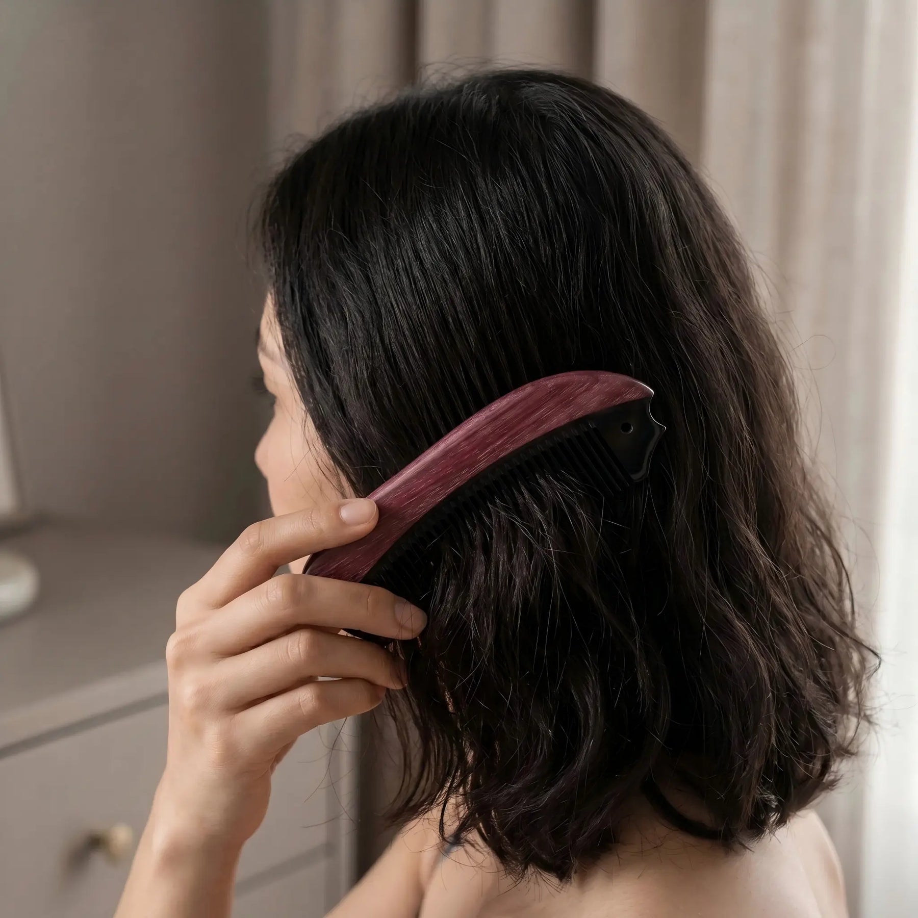 COZUY purpleheart and black ox horn pocket comb gently combing dark hair in a daily hair-care routine. detail image 5