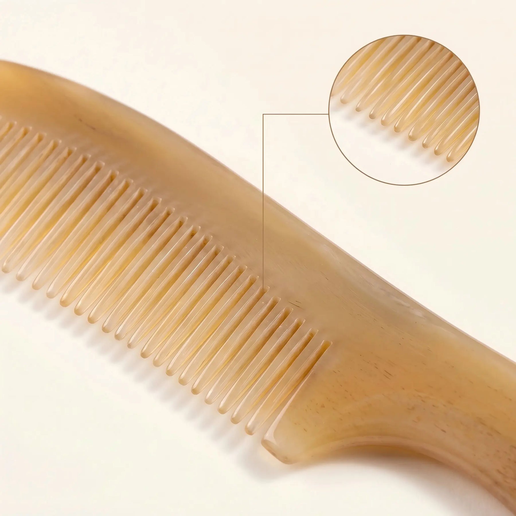 COZUY translucent sheep horn handle comb close-up showing warm translucency and rounded fine teeth. detail image 2