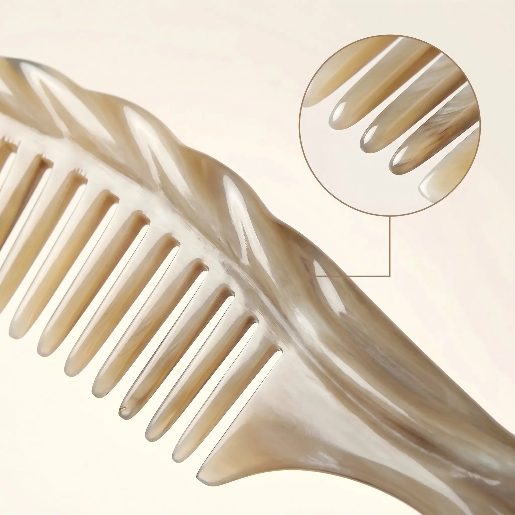COZUY carved white yak horn comb close-up showing pale marbled horn and rounded carved teeth. detail image 2